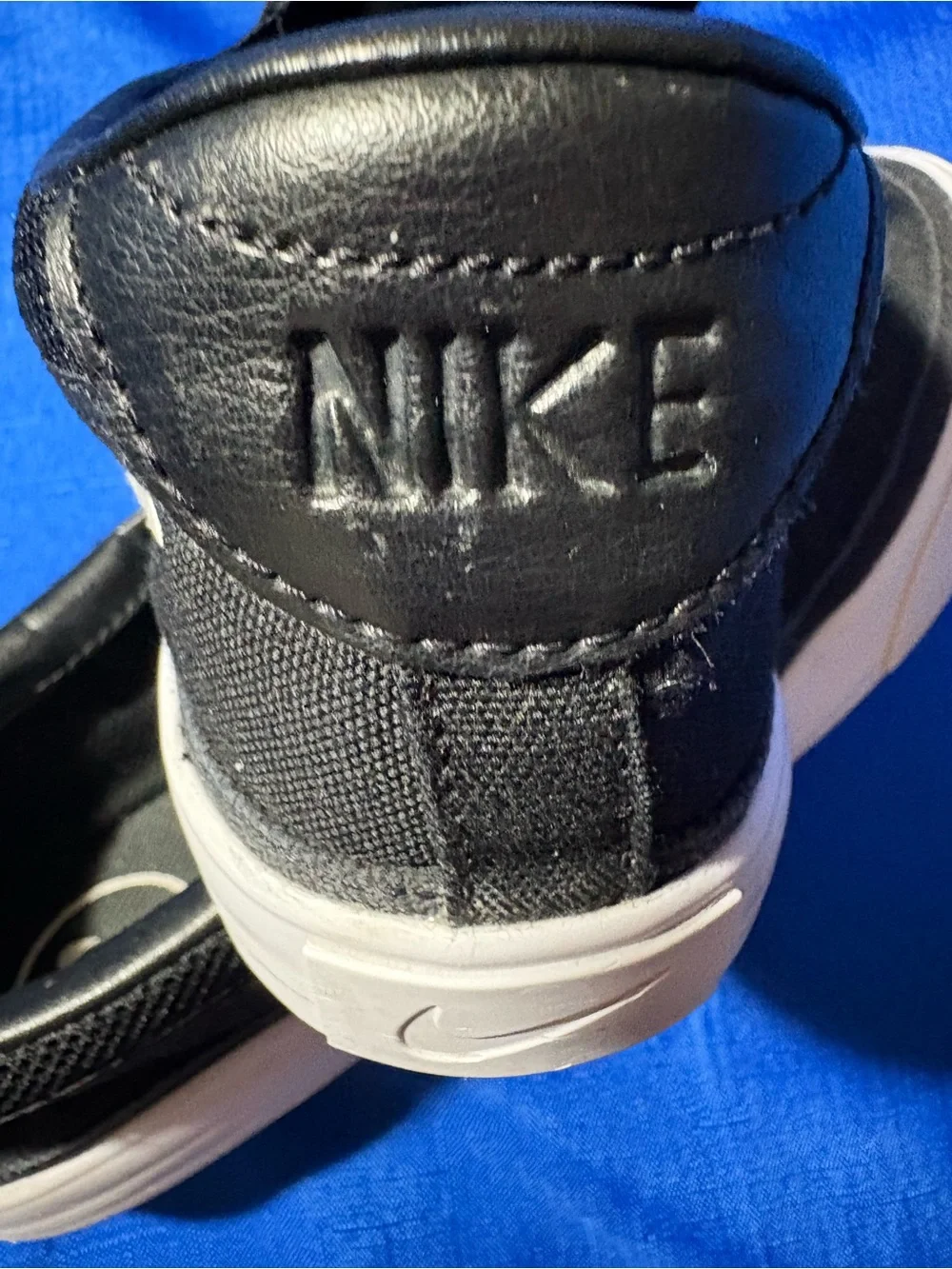 Nike Black Slip-On Canvas Sneakers with White Swoosh